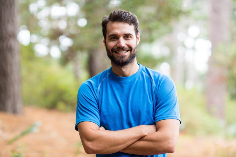 Smiling man who has implemented healthy habits to decrease male infertility factors | Positive Steps Fertility | Mississippi