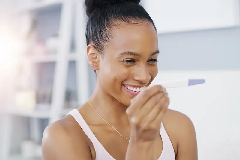 Woman reviewing her female fertility test results as part of a personalized fertility evaluation at Positive Steps Fertility in Mississippi and Louisiana