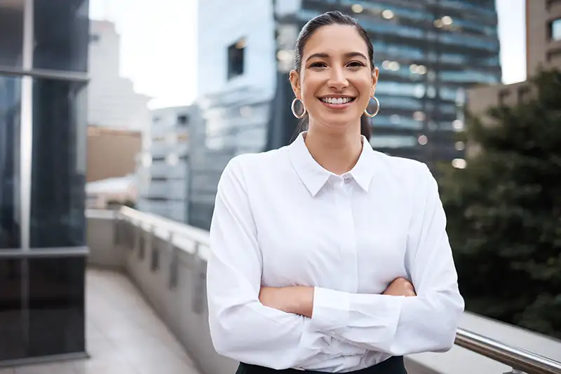 Smiling young professional woman after choosing egg freezing to preserve her future fertility at Positive Steps Fertility