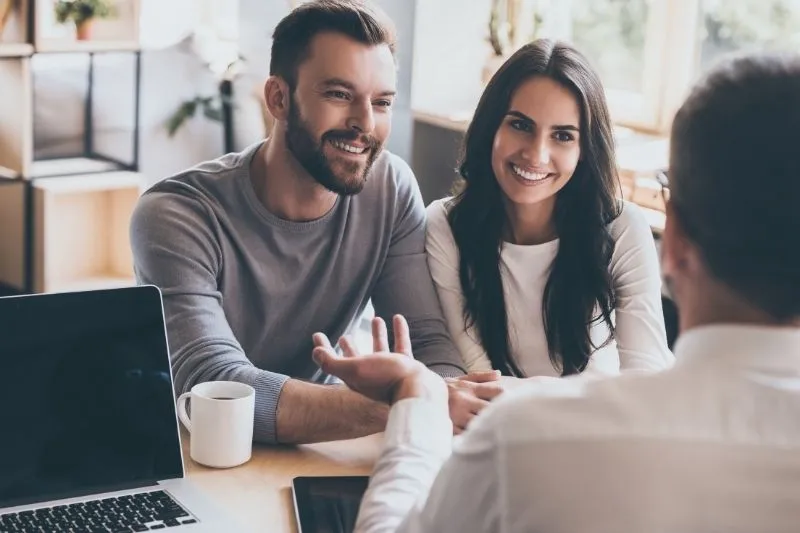 Couple meeting with a fertility lawyer to discuss IVF, surrogacy, and assisted reproductive technology legal considerations