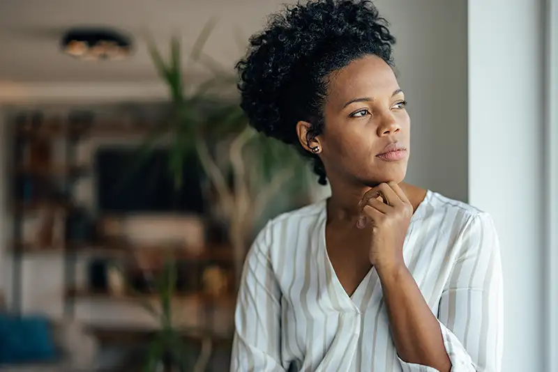 Woman experiencing pelvic pain from uterine fibroids, polyps, or other uterine conditions that may affect fertility