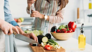 Couple preparing a healthy meal while trying to conceive