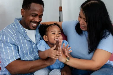 Happy parents with their toddler, symbolizing the hope and success of artificial insemination (AI) at Positive Steps Fertility