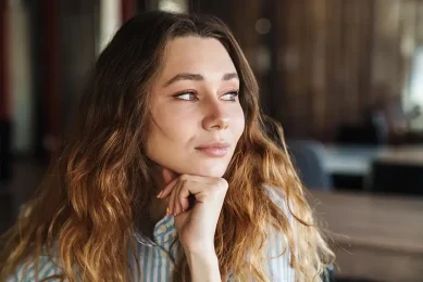 Woman seeking answers about female infertility causes with Positive Steps Fertility