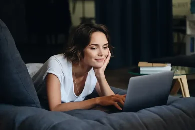 Woman completing an online fertility quiz on her laptop to take the first step toward fertility evaluation and treatment at Positive Steps Fertility in Mississippi and Louisiana