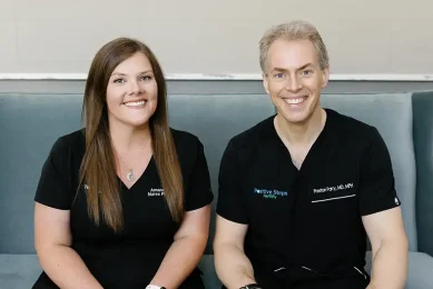 Fertility specialist smiling to represent the compassionate, personalized fertility care provided at Positive Steps Fertility